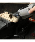 Must-Have 10-Piece Nylon Abrasive Wheel Kit With 120 To 600 Grit used on wood piece with rotary tool for detailing work.