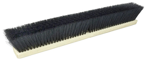 18 Inch Commercial Floor Broom With Black Polypropylene Bristles And Polystyrene Trim On A Lacquered Wood Handle, side view.