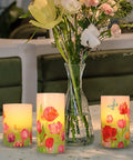 Flameless LED Candles With Remote Set Of 3 Real Wax Bunny Glass Decor on table next to floral vase, for home ambience.