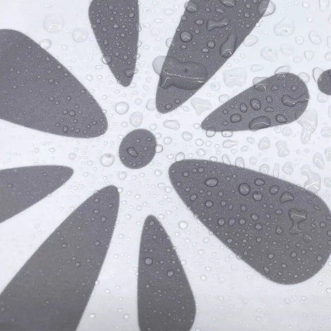 Close-up of wet grey clover design on vinyl sticker from 14 Strips Peel And Stick Stair Riser Decals Self Adhesive Vinyl Stickers For Steps