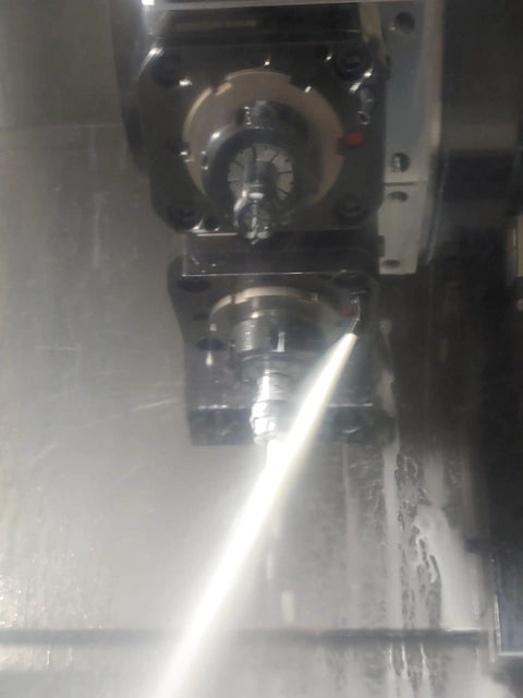 Close-up of 14 Piece Heavy Duty Coolant Nozzle Set For Cnc Lathe And Milling Rigs spraying coolant during machining.