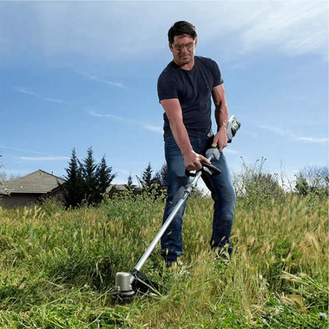 Man using AH1300 Replacement String Trimmer Head For Ego Power Plus ST1500 Series 15 Inch Trimmers in a grassy field