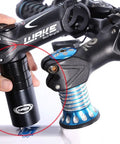 Adjustable Bike Stem Riser And Fork Extender For Mountain Road MTB BMX And Fixie Handles Up To Seventy Millimeter Extension Aluminum Alloy Head Up Adapter With Spacers Easy Install Black shown in installation on bike handle