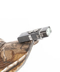 EDC Keychain Flashlight Pocket Friendly With Hybrid Dual Power AAA Battery System clipped on camouflage cap