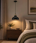 Black Industrial Metal Pendant Light, E26 Curvy Adjustable Ceiling Fixture hanging above a bedside table with decor.