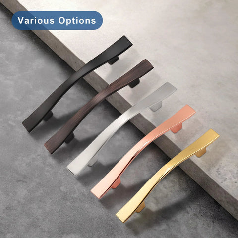 Various colored cabinet handles on a stone surface showing design options, related to 25 Pack Cabinet Handles With 3 Inch Hole Centers Bridge Design Shiny Nickel Zinc Alloy Drawer Pulls