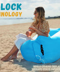 Inflatable Couch Air Lounger Chair For Camping And Beach Trips Portable Blow Up Sofa on a beach with a person seated.