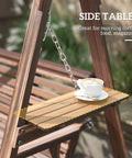 Close-up of side table on three seat outdoor porch swing with stand and side tables, wooden patio swing bench, carbonized brown finish.