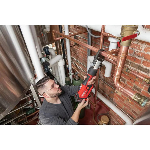 Plumber using ProPress RP 351 Press Tool Kit With 18V Battery Charger MegaPress Jaws One Half In to One In for copper pipe installation.