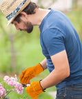 A man gardening wearing 12 Pairs Leather Work Gloves With Flexible Grip For Gardening And Construction Men And Women Cowhide Thorn Proof.