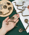 Old School Vintage Bail Pull Handles Set Of 10 In Antique Bronze For Cabinet Drawer Pulls with hand showcasing size