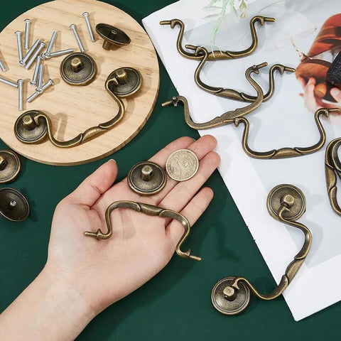 Old School Vintage Bail Pull Handles Set Of 10 In Antique Bronze For Cabinet Drawer Pulls with hand showcasing size