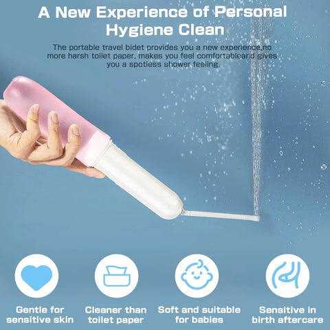Hand holding pink and white On The Go Bidet Sprayer For Travel And Personal Hygiene Portable Electric Cleanser spraying water.