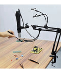 Ultimate Third Hand Soldering Station With Adjustable Gooseneck Arms Smoke Absorber shown in use on a desktop