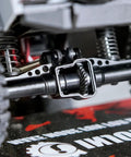 Close-up of Beefy Steel Helical Gear Set For One Eighteen Traxxas TRX4M RC Crawler showing front axle gear detail.