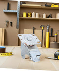 Rugged Steel Swivel Caster Bracket With Locking Brake And Four Inch Wheels for heavy machinery on a workshop table.