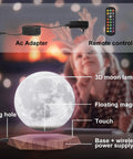 Levitating Moon Lamp With Remote, 6 Inch Floating 3D LED Moon Light With 18 Colors, Magnetic Spinning Base, shown on wood base.