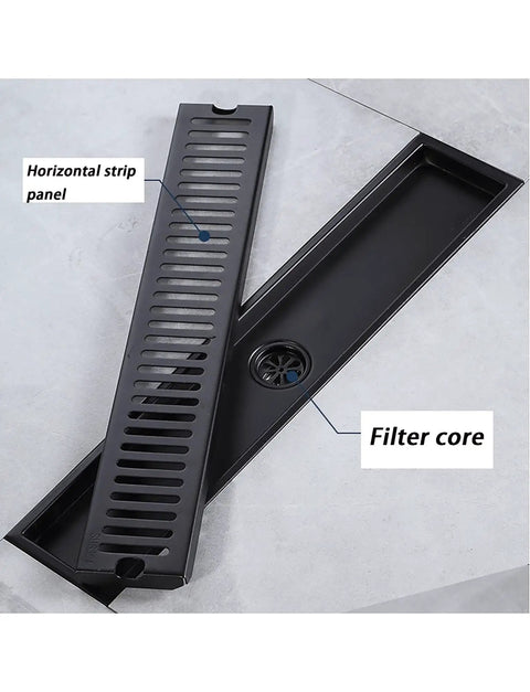 Top Shelf Black Linear Shower Drain Built Tough With 304 Stainless Steel And Slick Hair Catcher Plus No Sweat Tile Installation For Modern Bathroom Remodels detailed view of horizontal strip panel and filter core.