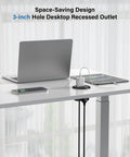 Sleek Flush Mount Power Grommet Featuring Four Standard Outlets And Four USB C Fast Charging Ports For Your Next Big Boss Setup, 3-inch black circular design under desk.