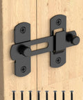 Heavy Duty Stainless Steel Sliding Barn Door Lock With Matte Black Finish, 180 Degree Safety Flip Gate Latch installed on wood