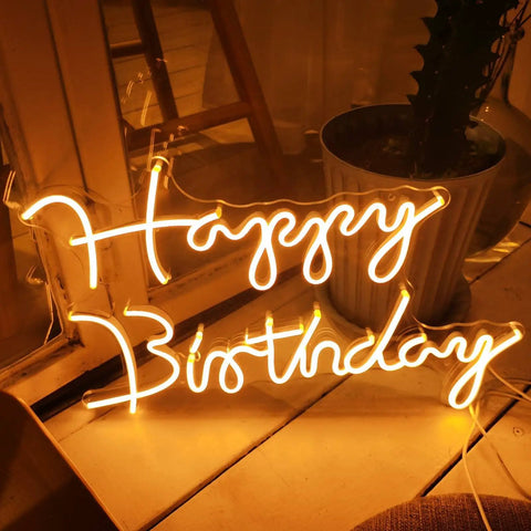 Happy Birthday LED Neon Sign 18 Inch For Backdrops And Parties, Warm White Neon Light Decor glowing on floor.