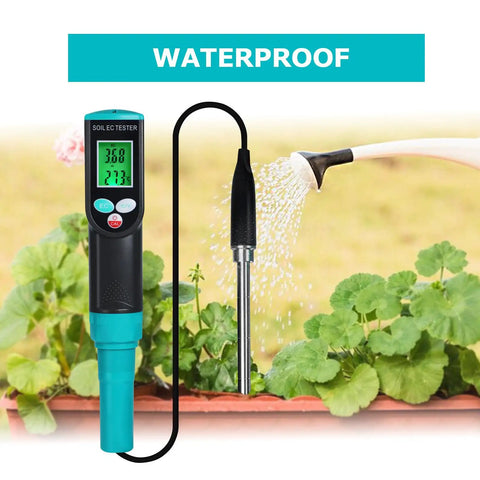 Pro Grade Soil EC Meter 2 In 1 Temperature Tester With Corded Sensor Backlit LCD Display beside watering can in garden