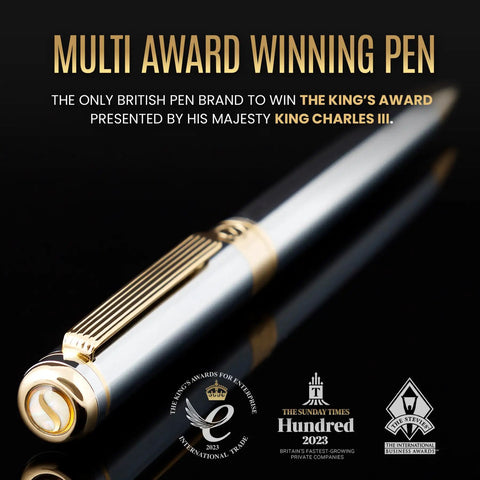 Luxurious Silver Chrome Ballpoint Pen With Real Gold Plating And Schmidt Black Refill showcasing awards on dark background