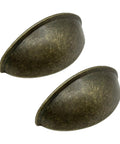 Antique Brass Cup Pulls Eight Pack With Two And A Half Inch Hole Centers Vintage Bin Style Cabinet Handles Close-Up