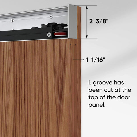 Close-up of concealed sliding barn door with L groove, brown wood, showing soft close hardware kit and hidden rail design.
