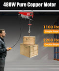 Heavy Duty 480W Mini Electric Hoist With Emergency Stop Button for Garage and Warehouse Use, lifting wooden boxes.
