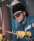 Man welding wearing 2 Pack Welding Caps For Men Washable Flame Resistant Cotton Welder Hats With Low Crown Elastic Fit in black.