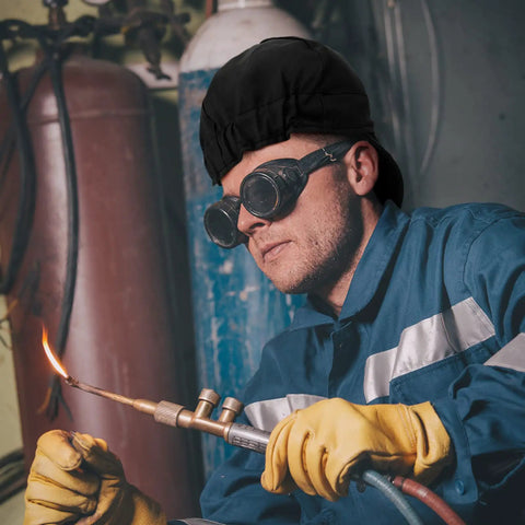 Man welding wearing 2 Pack Welding Caps For Men Washable Flame Resistant Cotton Welder Hats With Low Crown Elastic Fit in black.