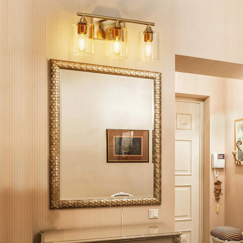 Three Light Vanity Light Fixtures Matte Black Finish With Clear Glass Shades Farmhouse Style Wall Lamp in bathroom.