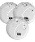 Three white round Hardwired Talking Photoelectric Smoke And Carbon Monoxide Alarm 3 Pack With Voice Location Alerts, front view.
