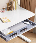 A detailed view of the small storage drawer in the Badass Height Adjustable Standing Desk With Manual Crank Drawer.