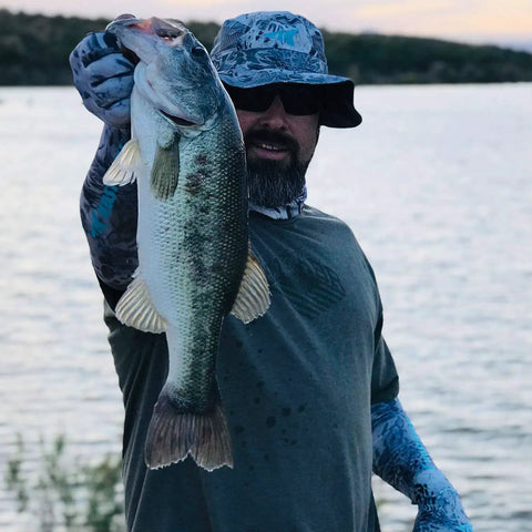 Person wearing Sol Armis UPF 50 Boonie Hat For Men And Women, Breathable Sun Protection Fishing Beach Hiking Paddling Hat With Mesh Vents.