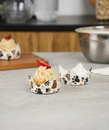 Cupcakes in paw print design liners showcasing Greaseproof Cupcake Liners 4000 Pack, 4 Oz Disposable Muffin Cups For Oven Or Freezer.
