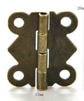 Close-up of a gold mini butterfly hinge, 17mm x 20mm, for jewelry boxes, wood boxes, dollhouse cabinets, and drawers, 180-degree opening.