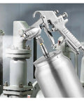 Built Tough Pneumatic Paint Sprayer With Slick Finishes And No Sweat Cleanup Ideal For Auto Detailing Furniture Makeovers And Handyman Projects Featuring Rust Resistant Steel Tips in use.