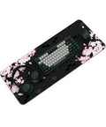 XL Gaming Mouse Pad With Anti Slip Rubber Base And Stitched Edges, Ultra Slick Glide, Huge 31.5 By 11.8 Inches, Anime Black Cherry Blossom Design, Desk Mat For Laptop And Keyboard, Non Slip Grippy Surface with a keyboard and mouse on it