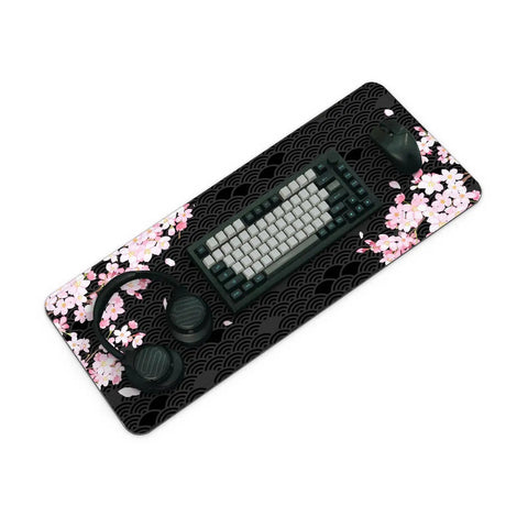 XL Gaming Mouse Pad With Anti Slip Rubber Base And Stitched Edges, Ultra Slick Glide, Huge 31.5 By 11.8 Inches, Anime Black Cherry Blossom Design, Desk Mat For Laptop And Keyboard, Non Slip Grippy Surface with a keyboard and mouse on it