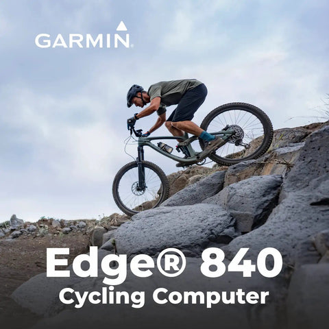 Cyclist using Edge 840 GPS Cycling Computer With Touchscreen And Button Controls on rocky trail, showcasing advanced navigation.
