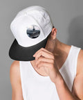 Person wearing white cap with custom photo print button from 12 Pack 2.4 Inch Round Button Pins Set Made From Durable Tinplate Metal