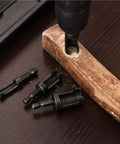 Bromirix 8-piece black wood plug cutter set on dark wood surface; straight and tapered bits with 1/4 in hex shanks