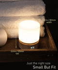 Dimmable LED Night Light with Timer for Nursery on wooden tray, 3.8 inches tall, warm 3000K glow, woodgrain bedside lamp.