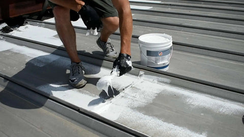 Applying Heavy Duty Hundred Percent Silicone Patch Coating For Waterproofing Those Tough To Reach Spots On Roofs Gutters And Walls Easy Application With Brush Or Putty Knife One Gallon Translucent on metal roof with brush