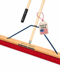 Heavy Duty 36 Inch Commercial Push Broom With Extended Handle For Hassle Free Indoor Outdoor Sweeping Built Like A Tank Workshop Floor Sweeper All Stainless Hardware Real American Made Rig with red bristles and hardwood handle.