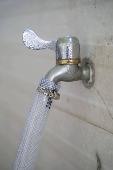 Three Quarter Inch ID By One Inch OD High Pressure Braided Clear PVC Tubing Ten Foot Heavy Duty Flexible Vinyl Hose attached to faucet
