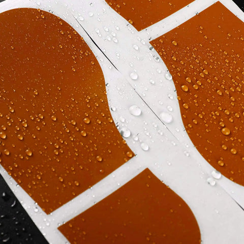 Close-up of 45 pairs 90 footprint floor stickers set for classrooms and dance studios waterproof PVC decals with water droplets