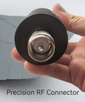 Pro Grade 50 Watt 50 Ohm UHF PL259 Dummy Load For Ham Radio And Antenna Testing shown in hand, close-up view